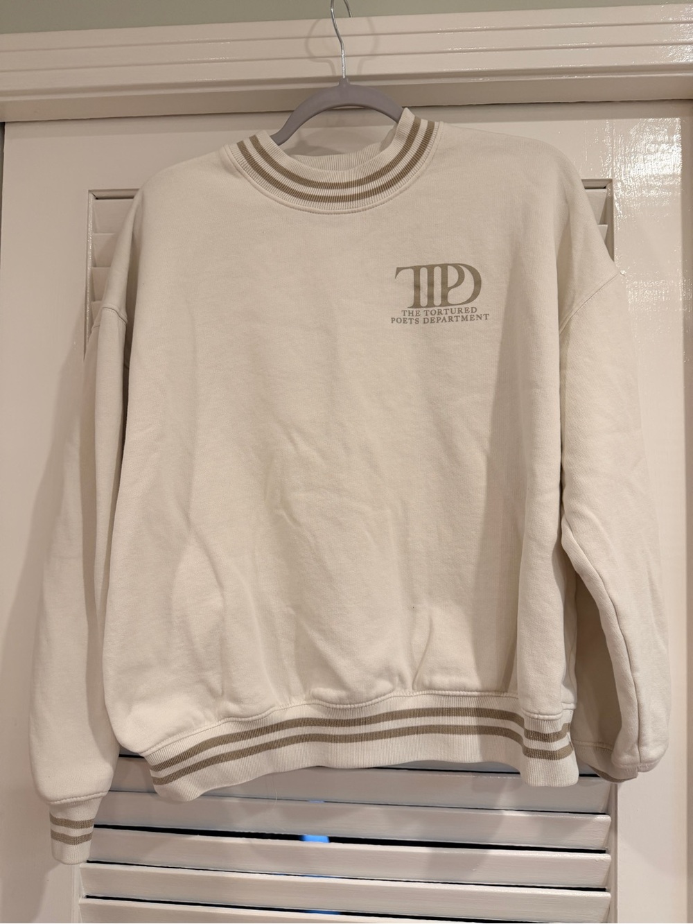 Taylor Swift Cream Sweatshirt with Beige Stripe Accents